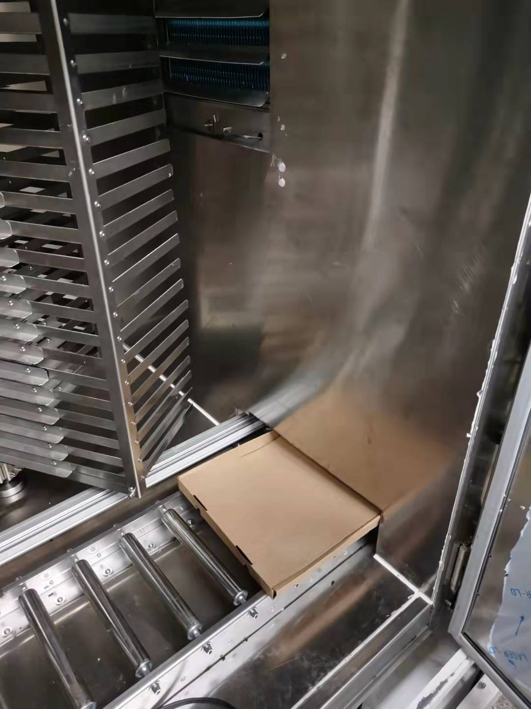 Shipping containers being loaded onto a large cargo ship at a busy port